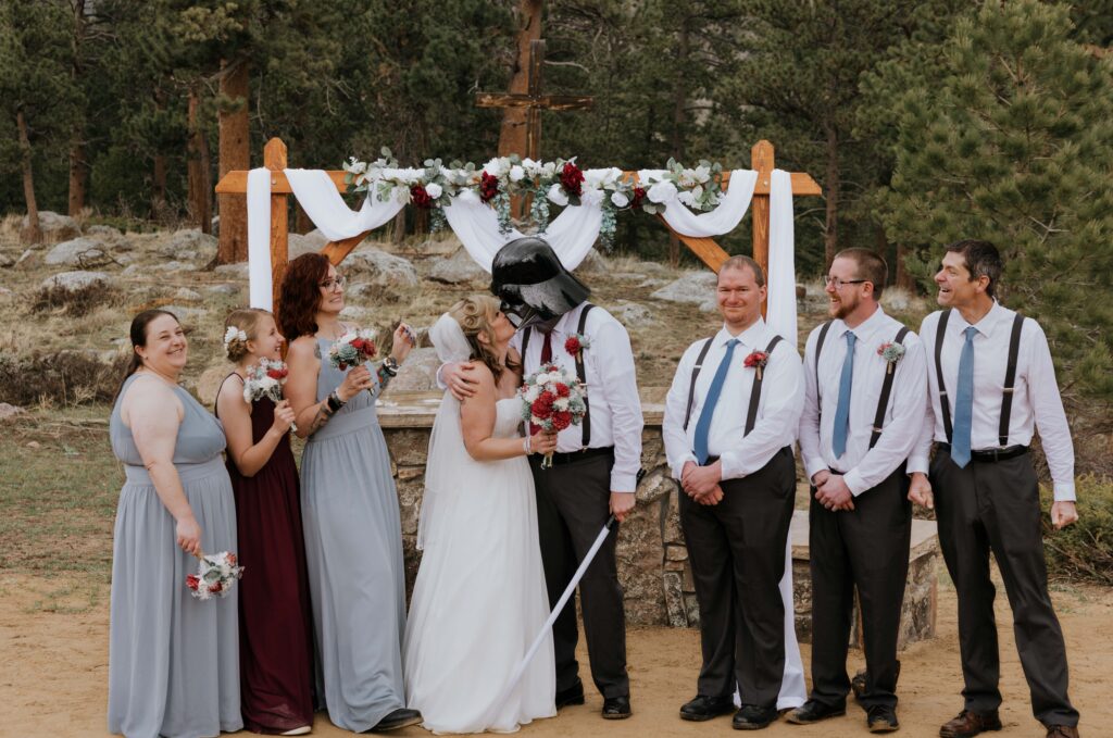 Star Wars Themed wedding photo with the groom wearing a Darth Vader mask