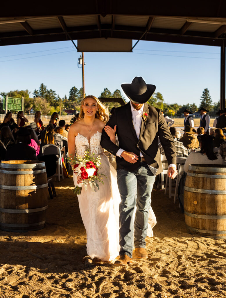 Couple walking down aisle after ceremony